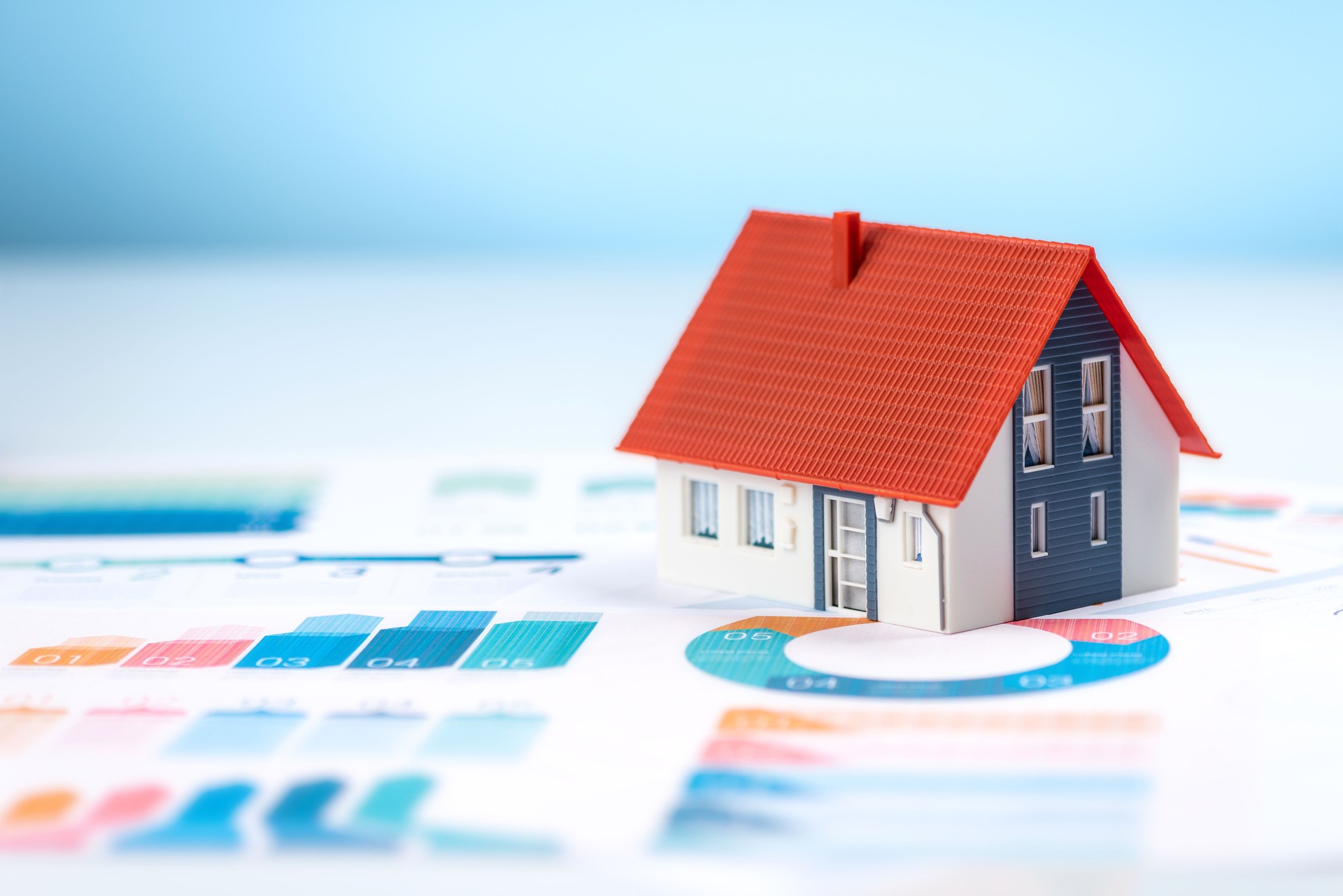 Model house on a financial graph